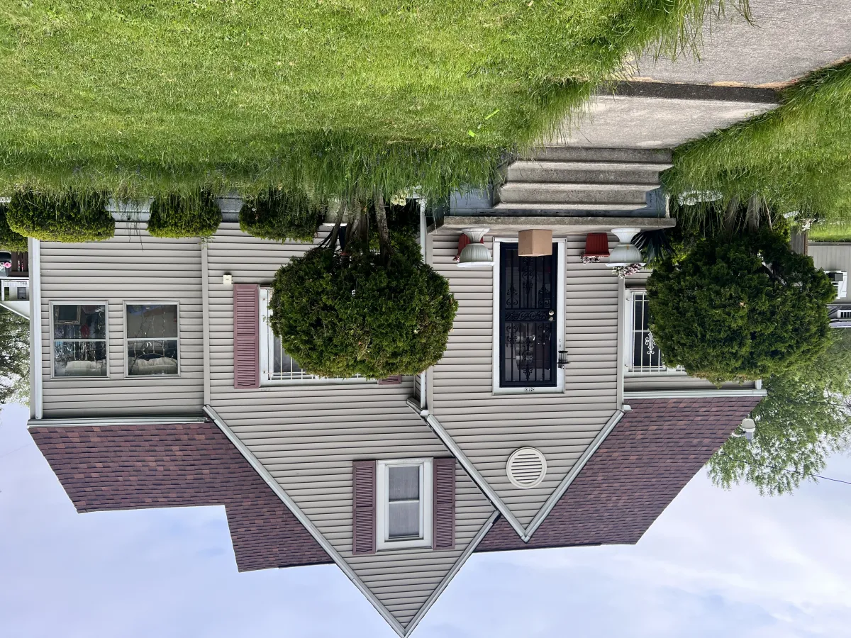 Replacing a foggy double-hung window in a Saginaw home.